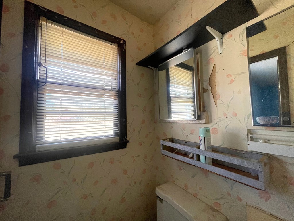 1135 Casteel Road Powder Springs, GA 30127 - Photo 34 of 45 a bathroom with a granite countertop sink and a mirror