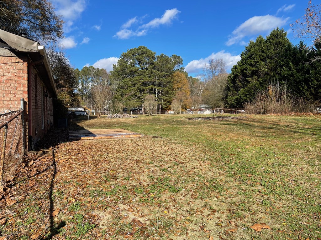 1135 Casteel Road Powder Springs, GA 30127 - Photo 8 of 45 a view of a yard next to a building