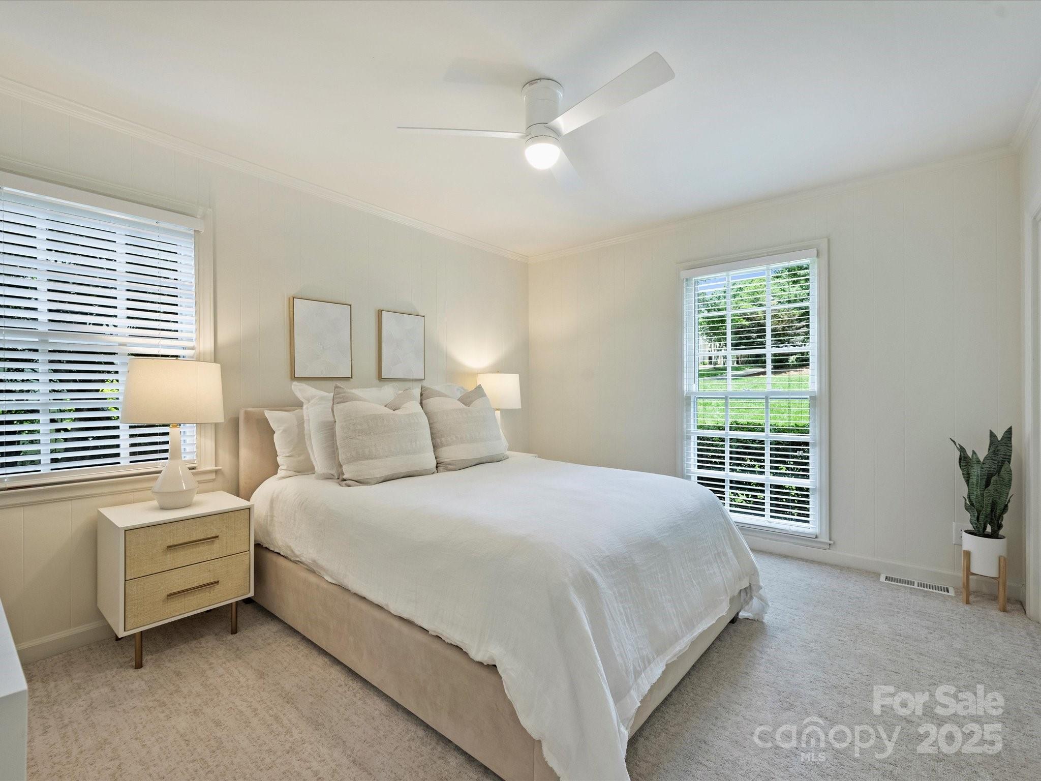 2919 Wickersham Road Charlotte, NC 28211 - Photo 17 of 30 a bedroom with a bed and a window