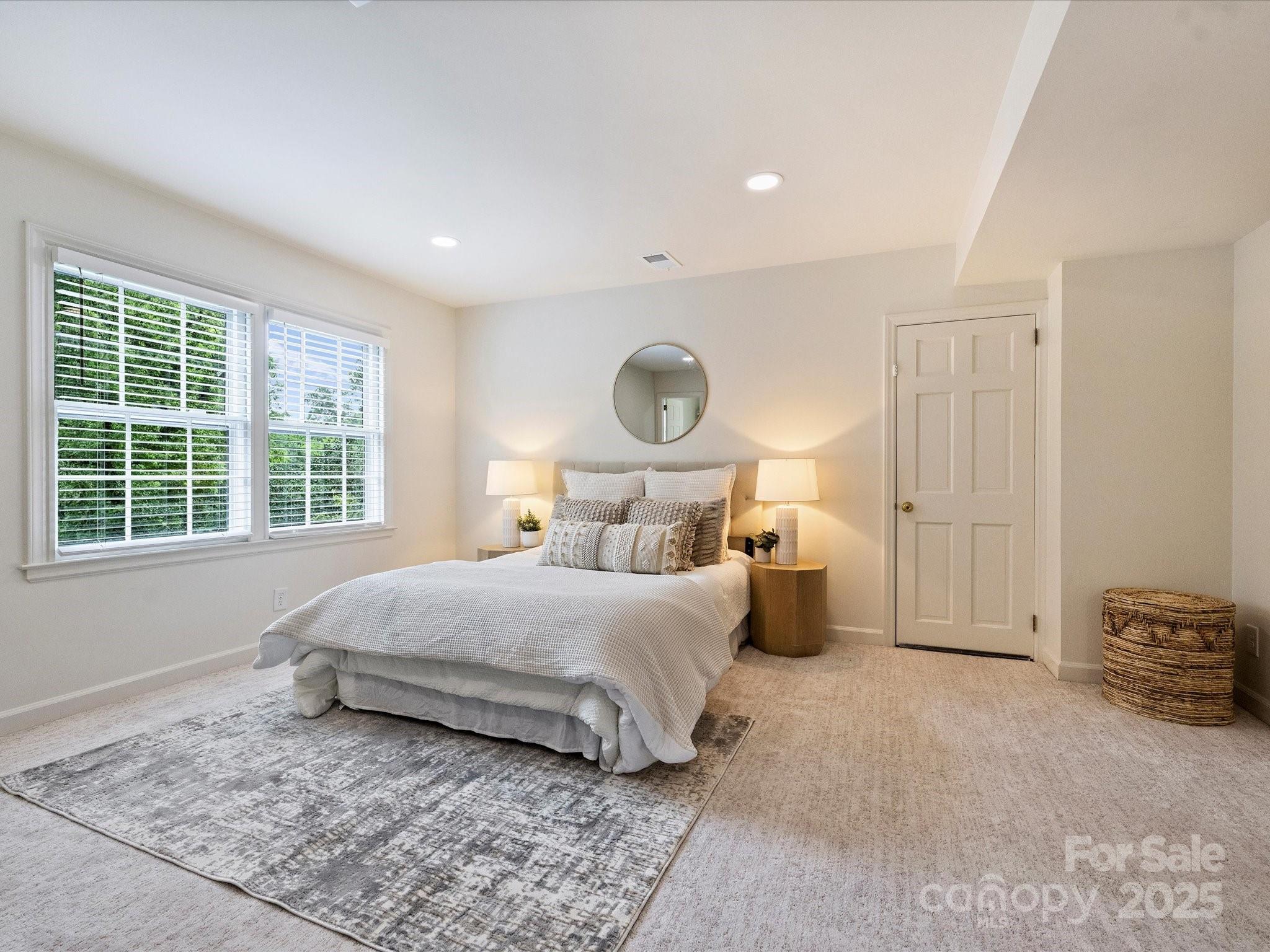 2919 Wickersham Road Charlotte, NC 28211 - Photo 21 of 30 a bedroom with a bed and a closet