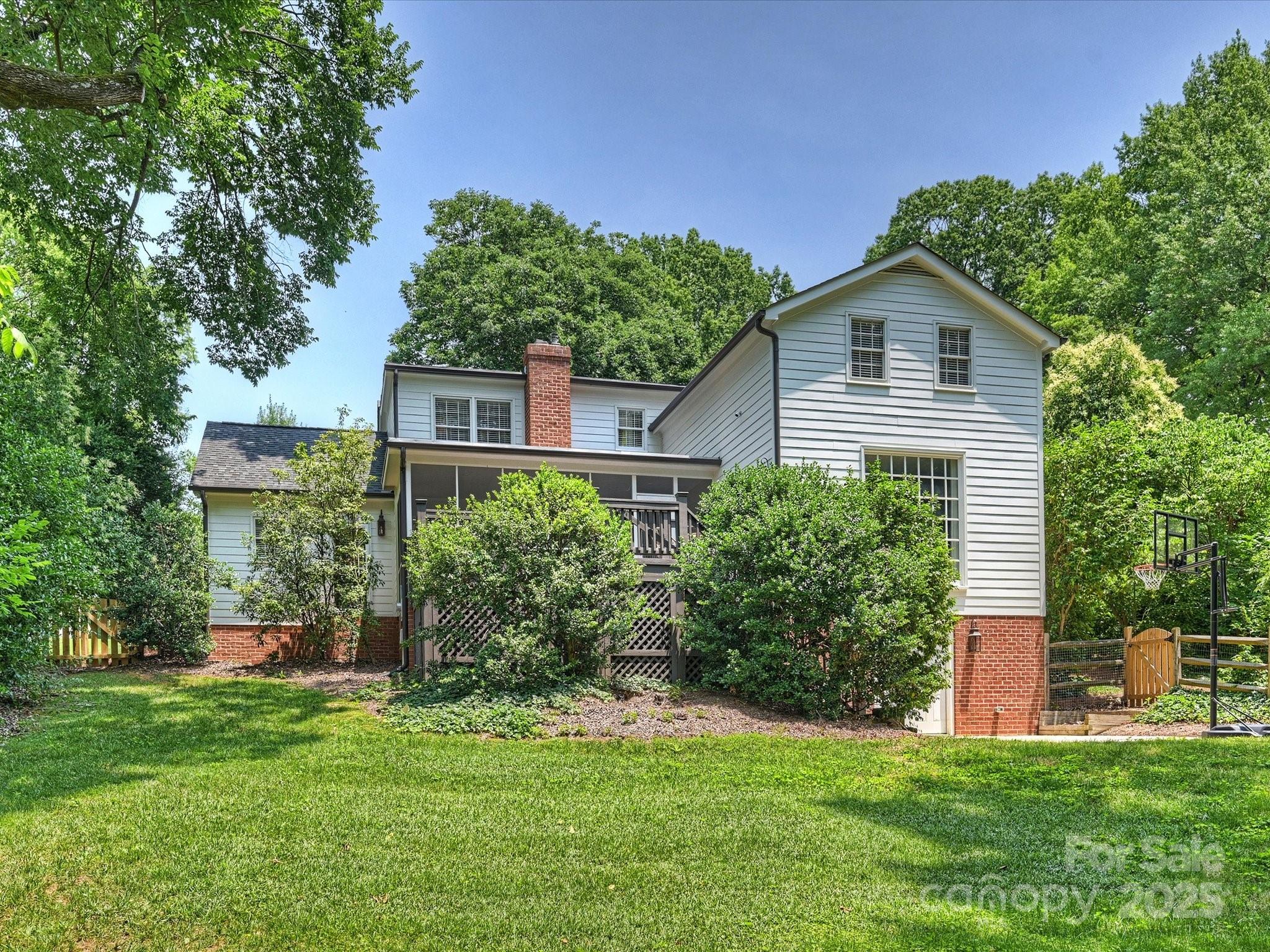 2919 Wickersham Road Charlotte, NC 28211 - Photo 29 of 30 a front view of a house with a yard and trees