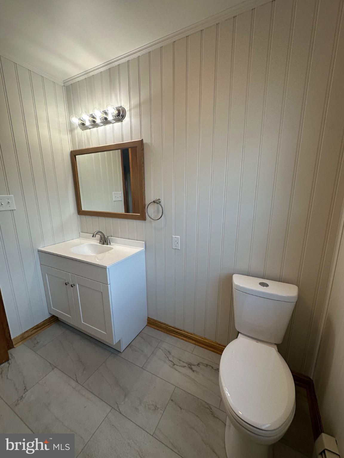 1825 White Hall Road Littlestown, PA 17340 - Photo 15 of 89 a bathroom with a toilet a sink and mirror