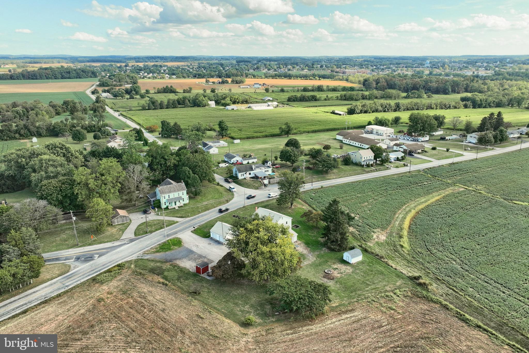 1825 White Hall Road Littlestown, PA 17340 - Photo 23 of 89 an aerial view of a city with lots of residential buildings and mountain view in back