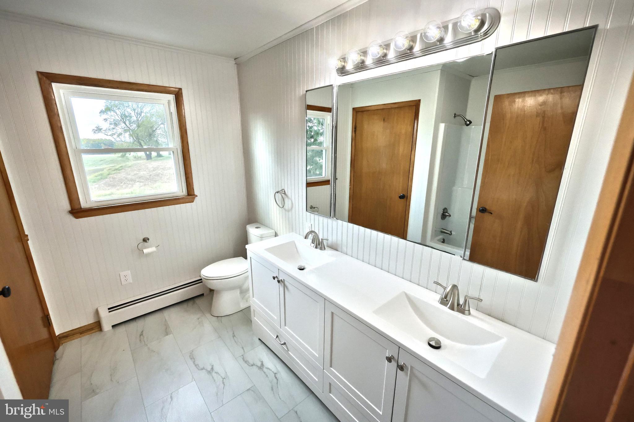 1825 White Hall Road Littlestown, PA 17340 - Photo 36 of 89 a bathroom with a double vanity sink mirror and toilet