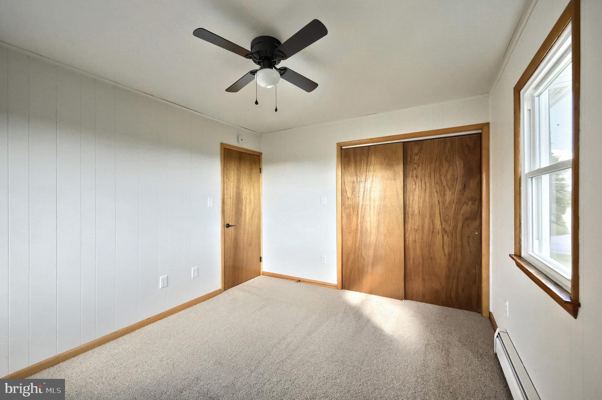 1825 White Hall Road Littlestown, PA 17340 - Photo 37 of 89 a view of a livingroom with a ceiling fan and window