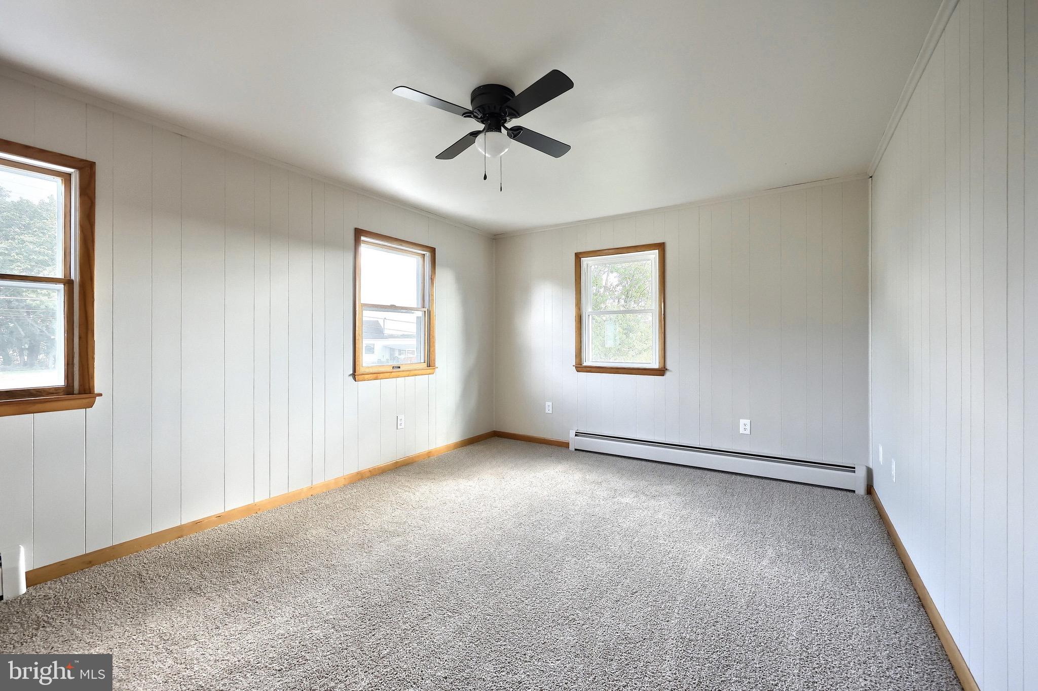 1825 White Hall Road Littlestown, PA 17340 - Photo 42 of 89 an empty room with windows and ceiling fan