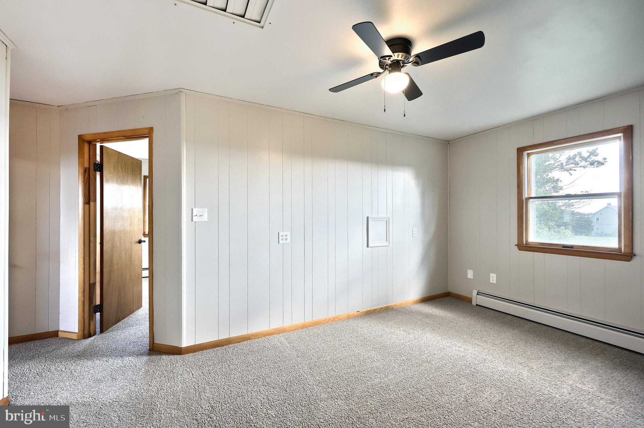 1825 White Hall Road Littlestown, PA 17340 - Photo 43 of 89 a view of a livingroom with a ceiling fan & windows