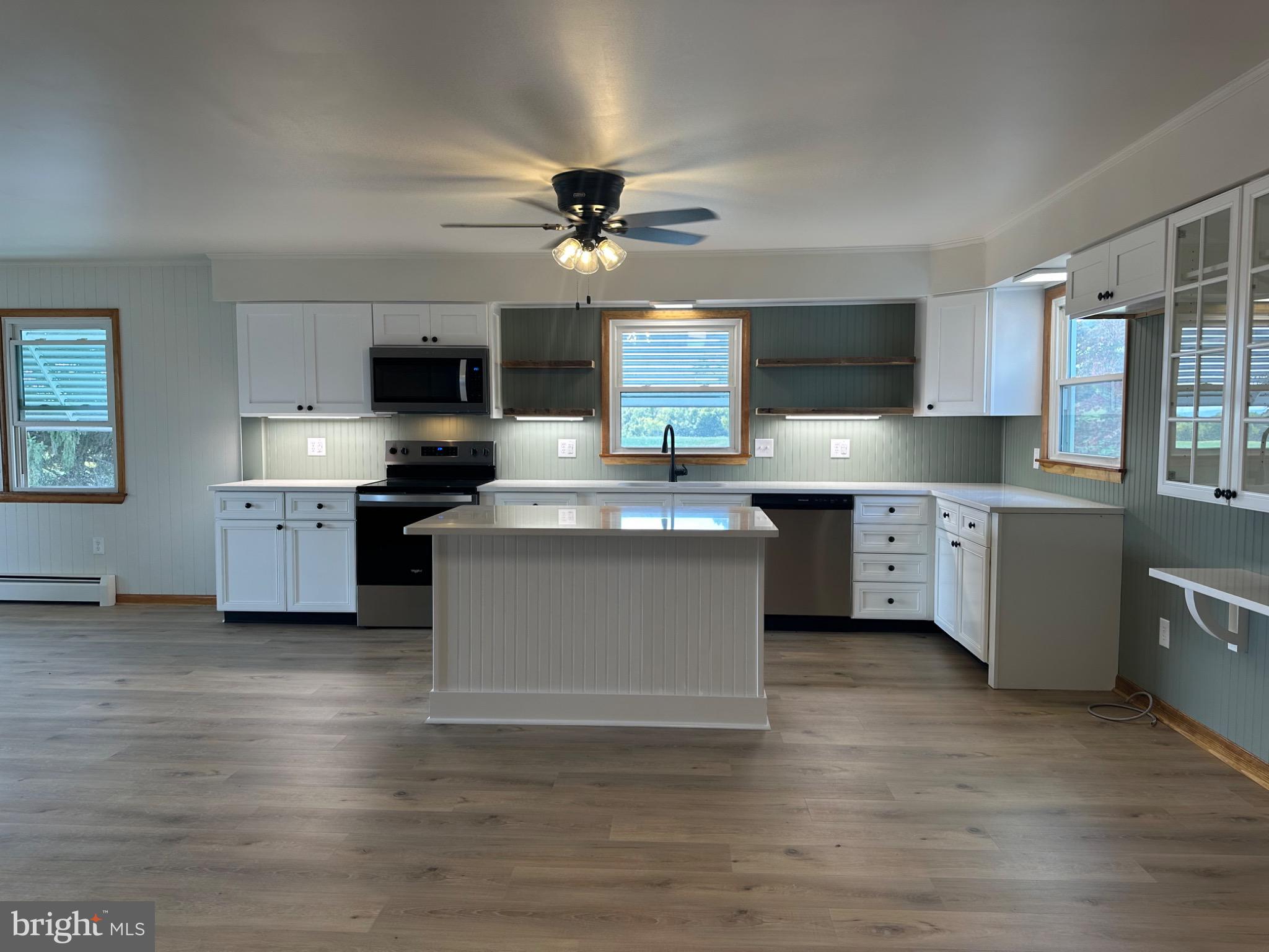 1825 White Hall Road Littlestown, PA 17340 - Photo 5 of 89 a kitchen with stainless steel appliances a sink a stove top oven a counter space and cabinets