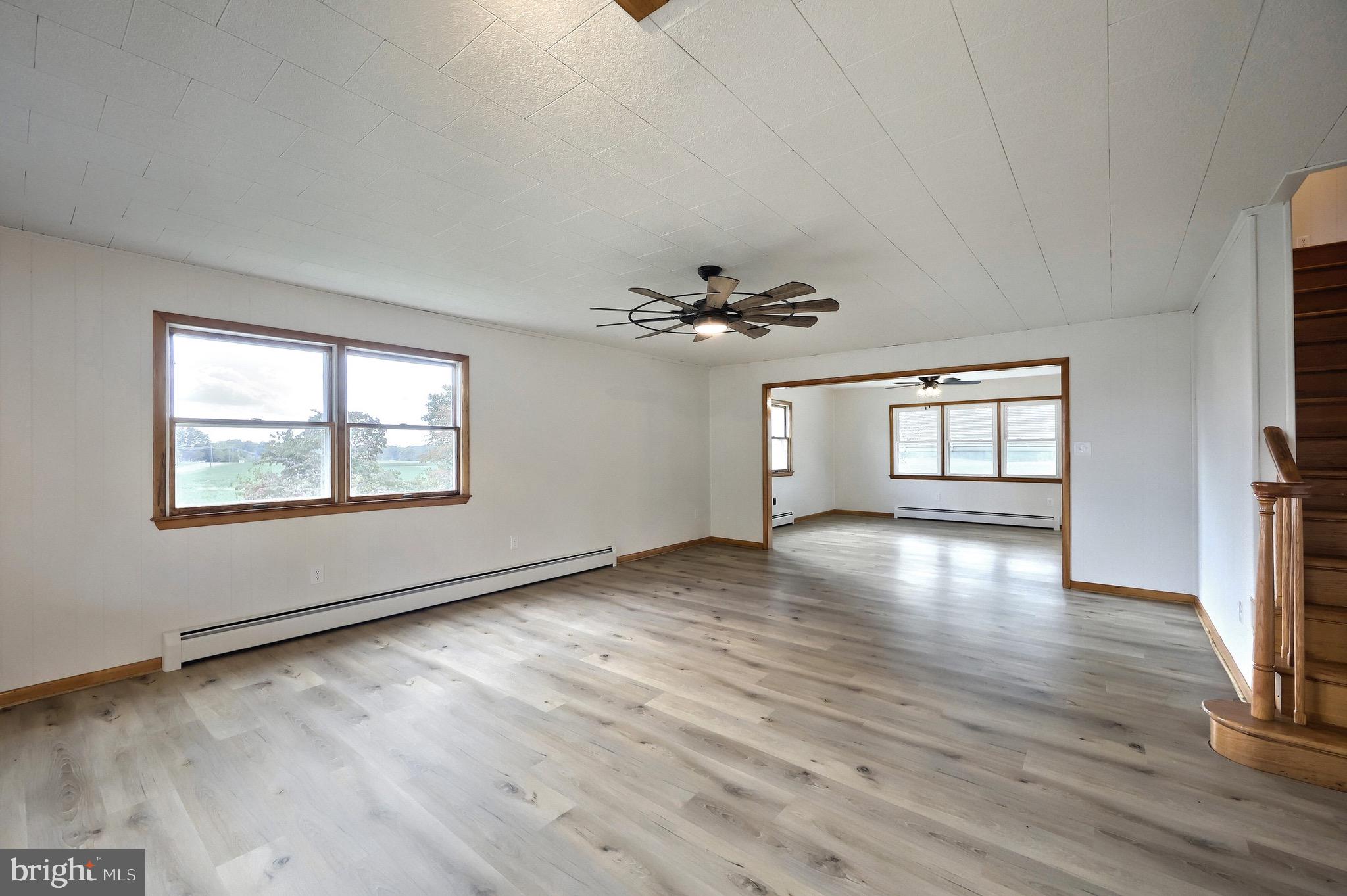 1825 White Hall Road Littlestown, PA 17340 - Photo 52 of 89 a view of an empty room with a window and wooden floor