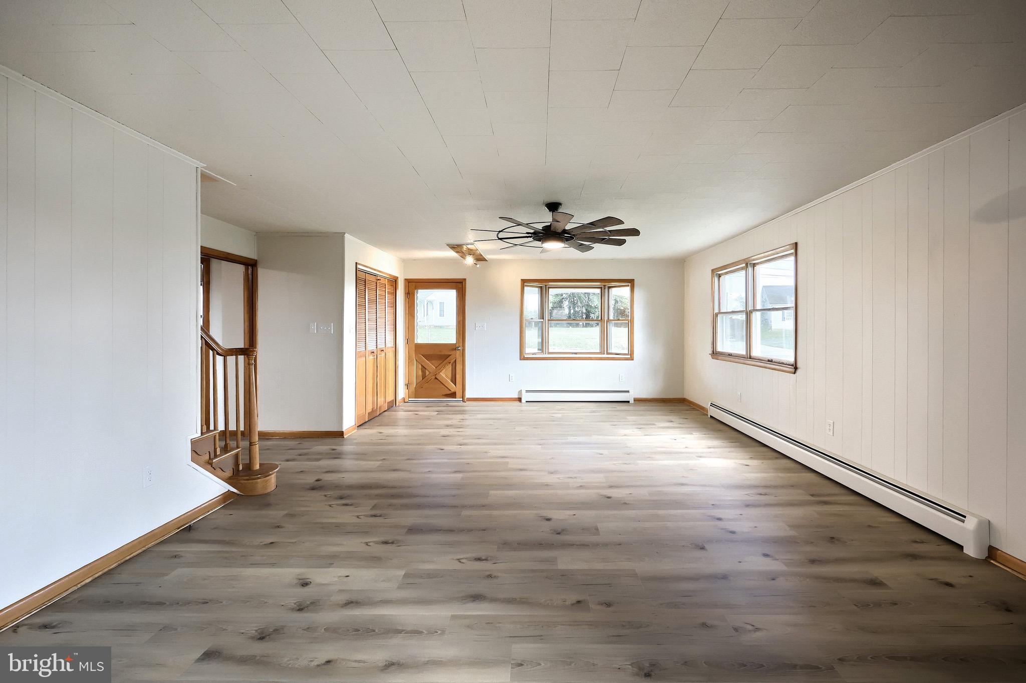 1825 White Hall Road Littlestown, PA 17340 - Photo 55 of 89 an empty room with wooden floor and windows