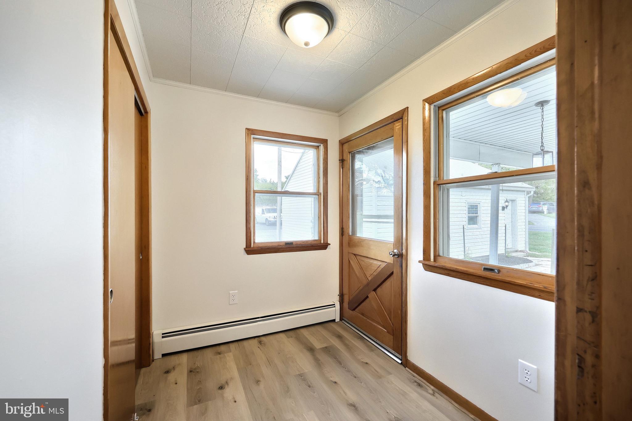 1825 White Hall Road Littlestown, PA 17340 - Photo 65 of 89 an empty room with wooden floor and windows