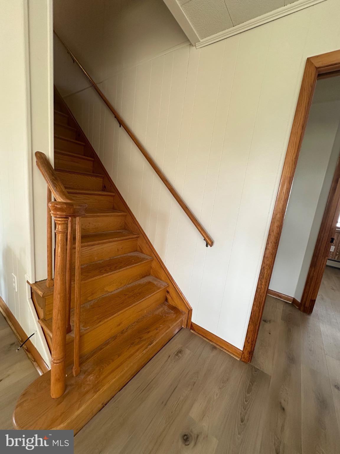 1825 White Hall Road Littlestown, PA 17340 - Photo 10 of 89 Inviting staircase with warm wooden accents.