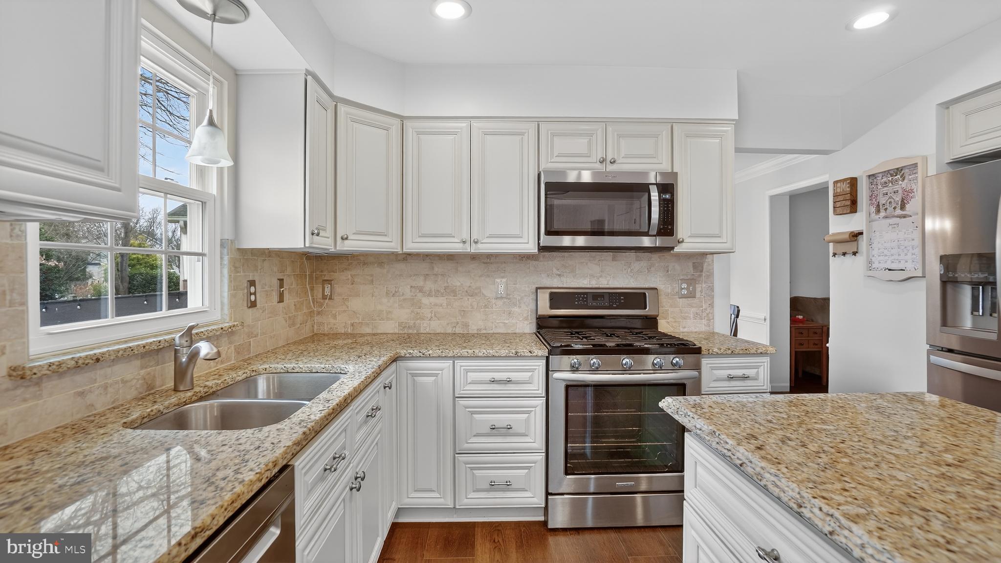 2709 Bains Court Crofton, MD 21114 - Photo 14 of 63 a kitchen with a sink stove top oven and refrigerator