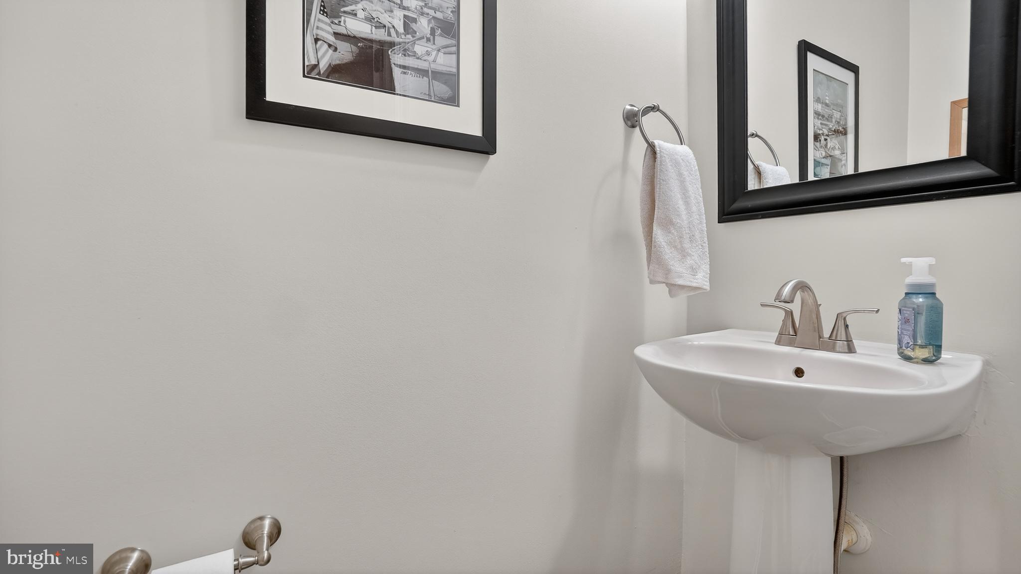 2709 Bains Court Crofton, MD 21114 - Photo 22 of 63 a bathroom with a sink and a mirror