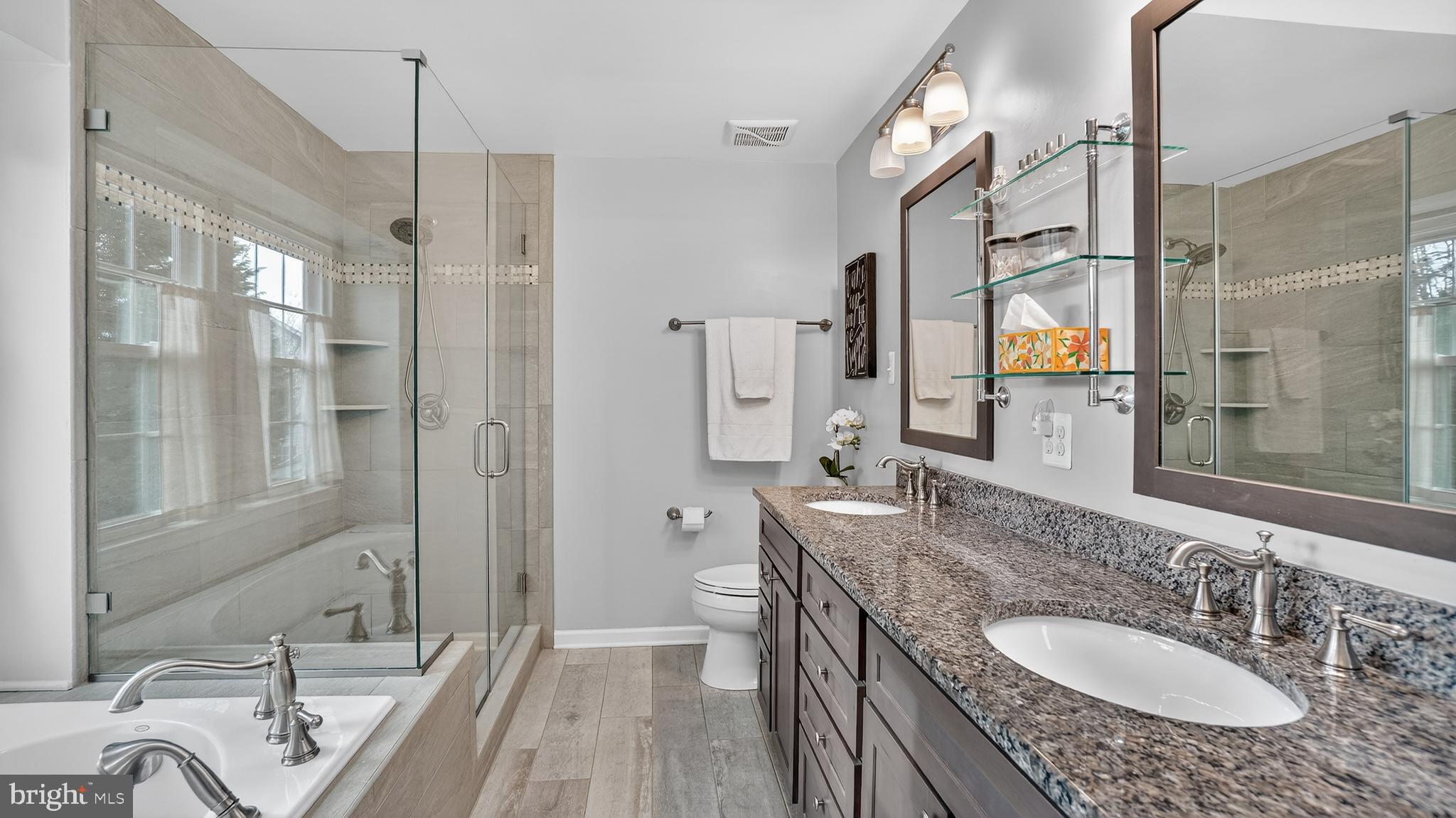 2709 Bains Court Crofton, MD 21114 - Photo 28 of 63 a bathroom with a granite countertop double vanity sink a mirror and a shower