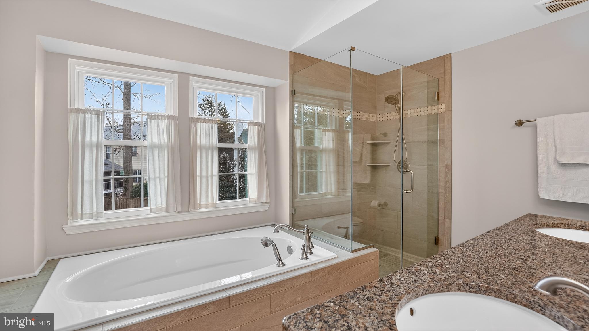 2709 Bains Court Crofton, MD 21114 - Photo 29 of 63 a bathroom with a granite countertop tub toilet sink and shower