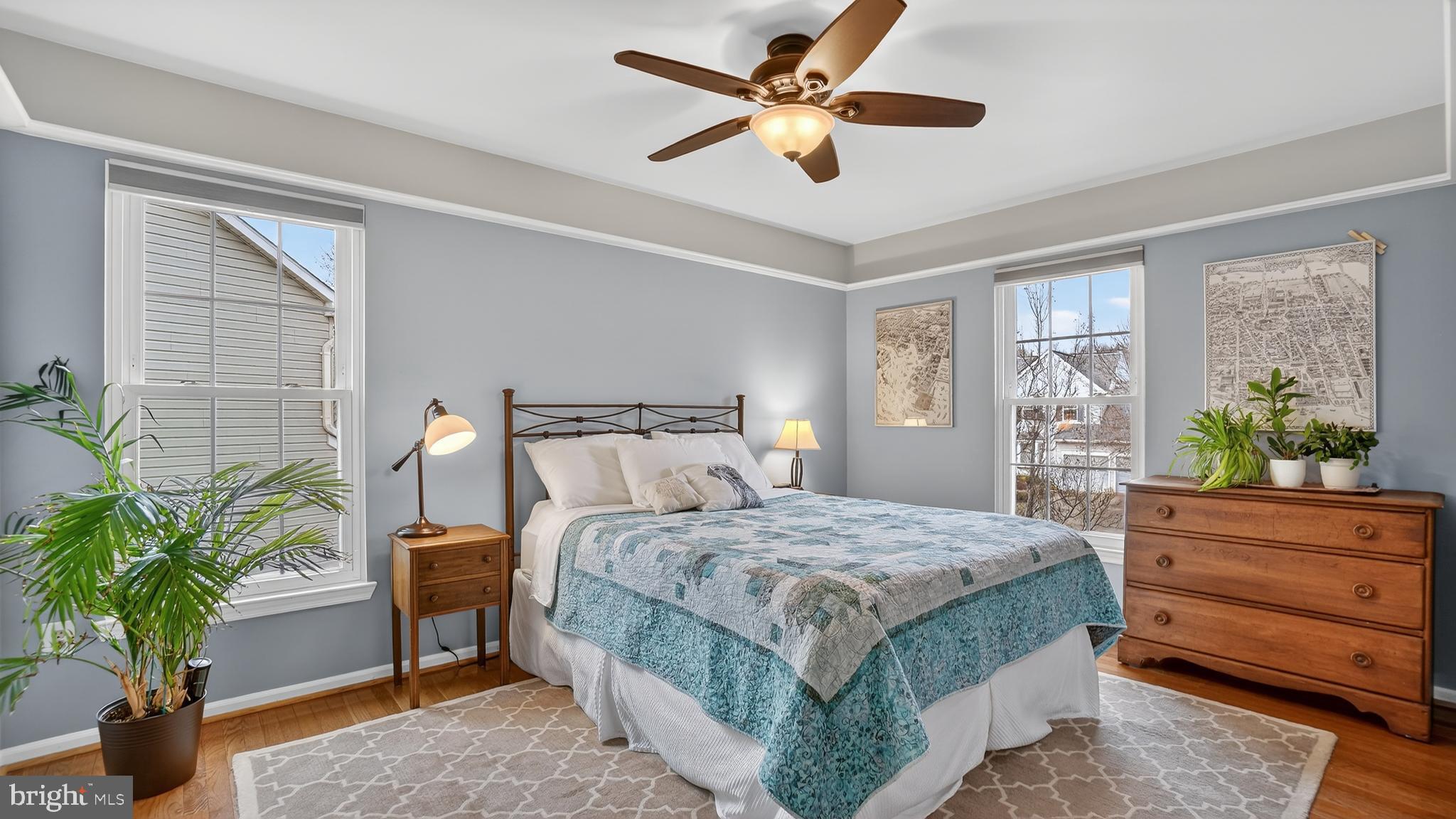 2709 Bains Court Crofton, MD 21114 - Photo 32 of 63 a bedroom with a bed and a potted plant