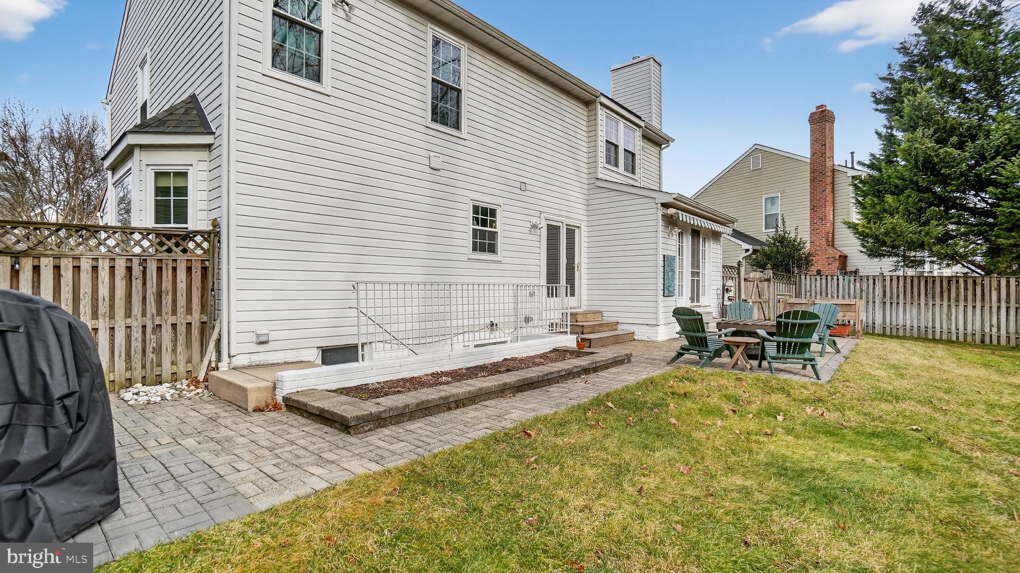 2709 Bains Court Crofton, MD 21114 - Photo 51 of 63 a view of a patio with a table and chairs and wooden fence