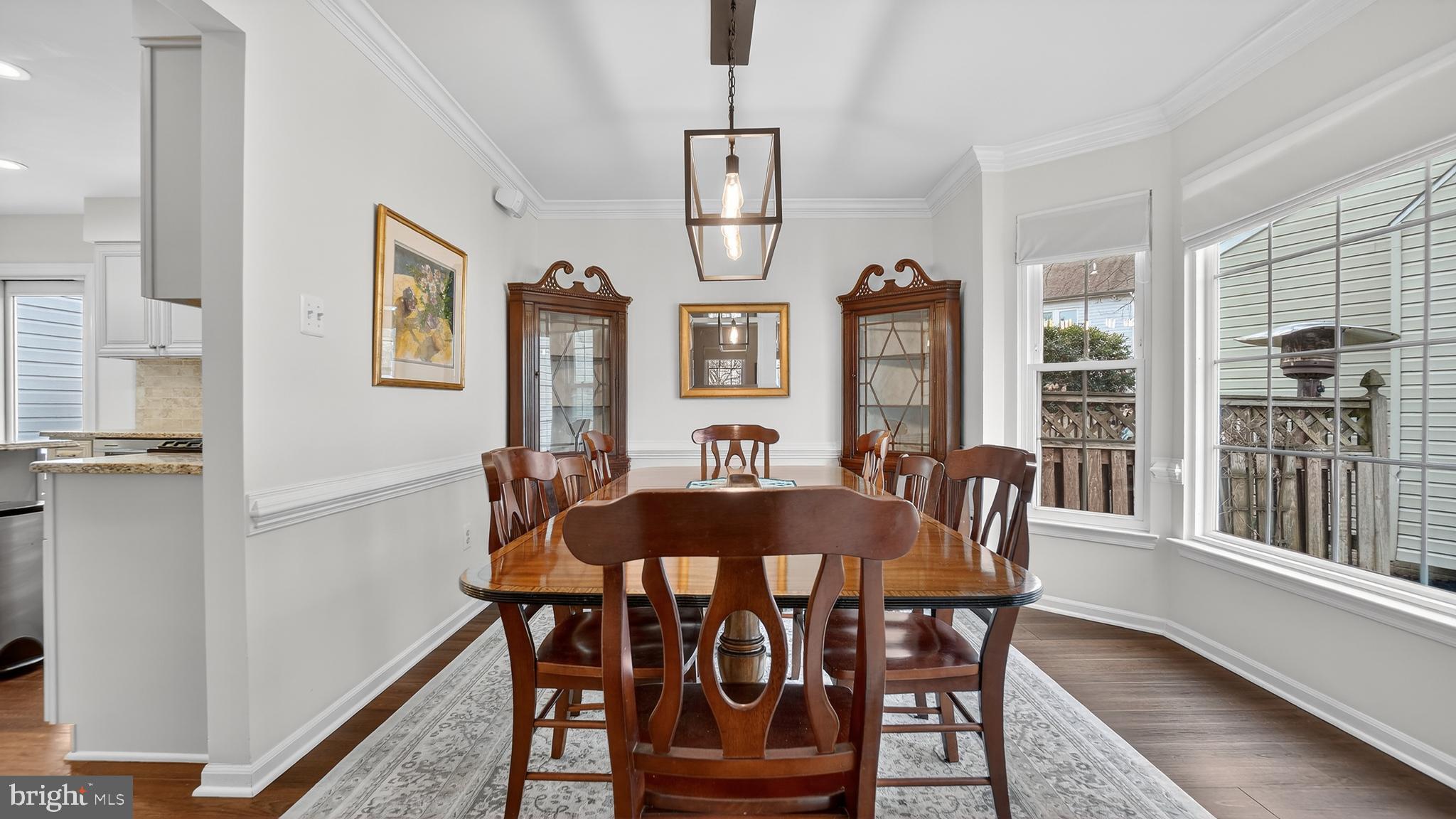 2709 Bains Court Crofton, MD 21114 - Photo 9 of 63 a view of a dining room with furniture window and wooden floor