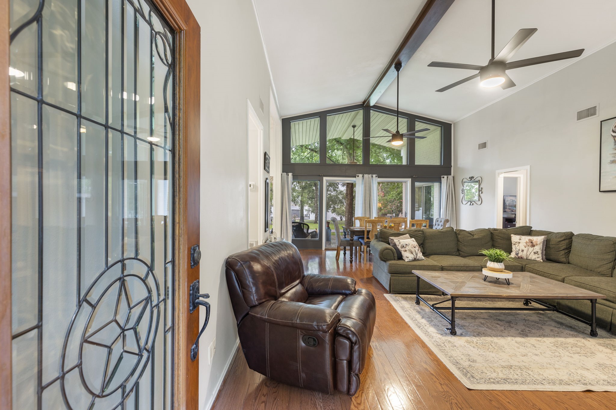 245 Lakeland Road Huntsville, TX 77320 - Photo 6 of 49 The front entrance features expansive windows that offer breathtaking views of the serene lake