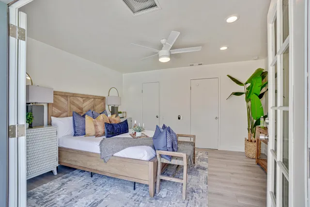 a living room with furniture and a potted plant