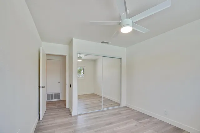 an empty room with wooden floor