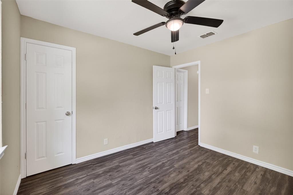 7528 Meadowlark Lane North Watauga, TX 76148 - Photo 16 of 31 a view of an empty room with wooden floor