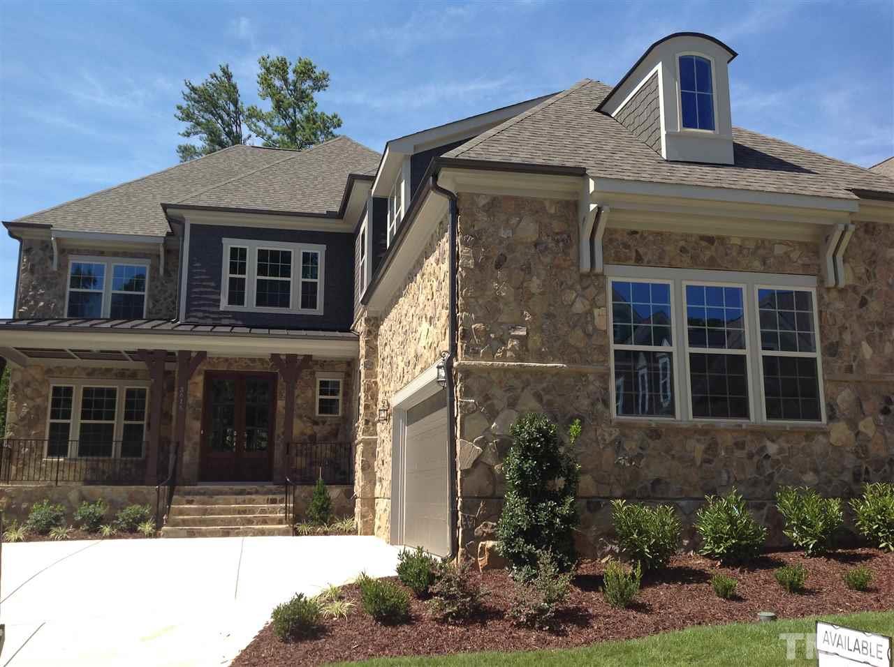 3619 Rolston Drive, Unit 10 Raleigh, NC 27609 - Photo 1 of 14 a front view of a house with garden