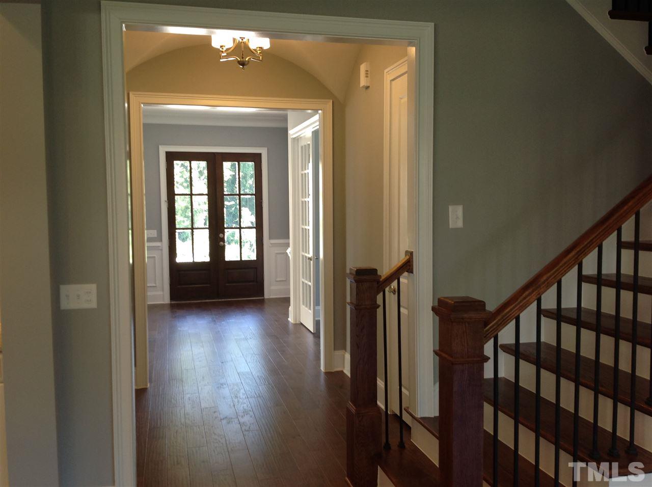 3619 Rolston Drive, Unit 10 Raleigh, NC 27609 - Photo 4 of 14 a view of a hallway with wooden floor and stairs