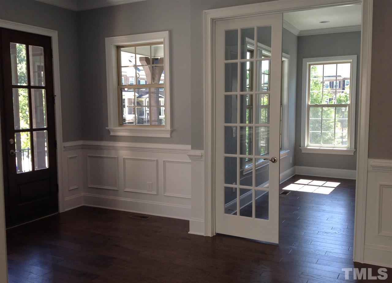 3619 Rolston Drive, Unit 10 Raleigh, NC 27609 - Photo 5 of 14 an empty room with wooden floor and windows