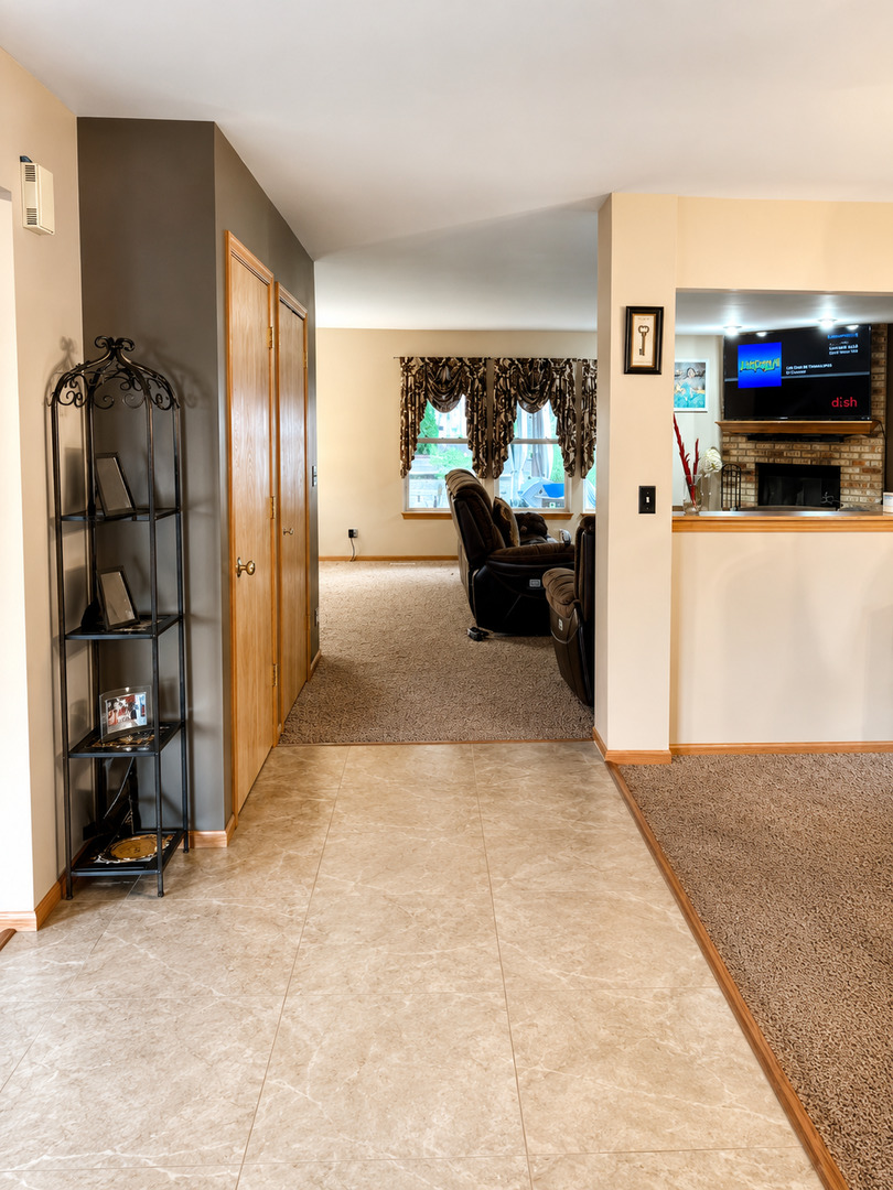 720 Ridge Drive Marengo, IL 60152 - Photo 2 of 34 a view of a living room entryway and a livingroom