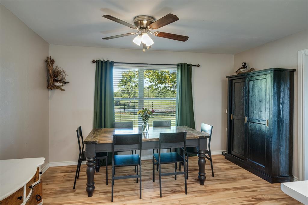 917 Cole Lane Sunset, TX 76270 - Photo 11 of 40 a view of a dining room with furniture window and outside view