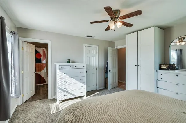 a bathroom with a toilet a sink and tub