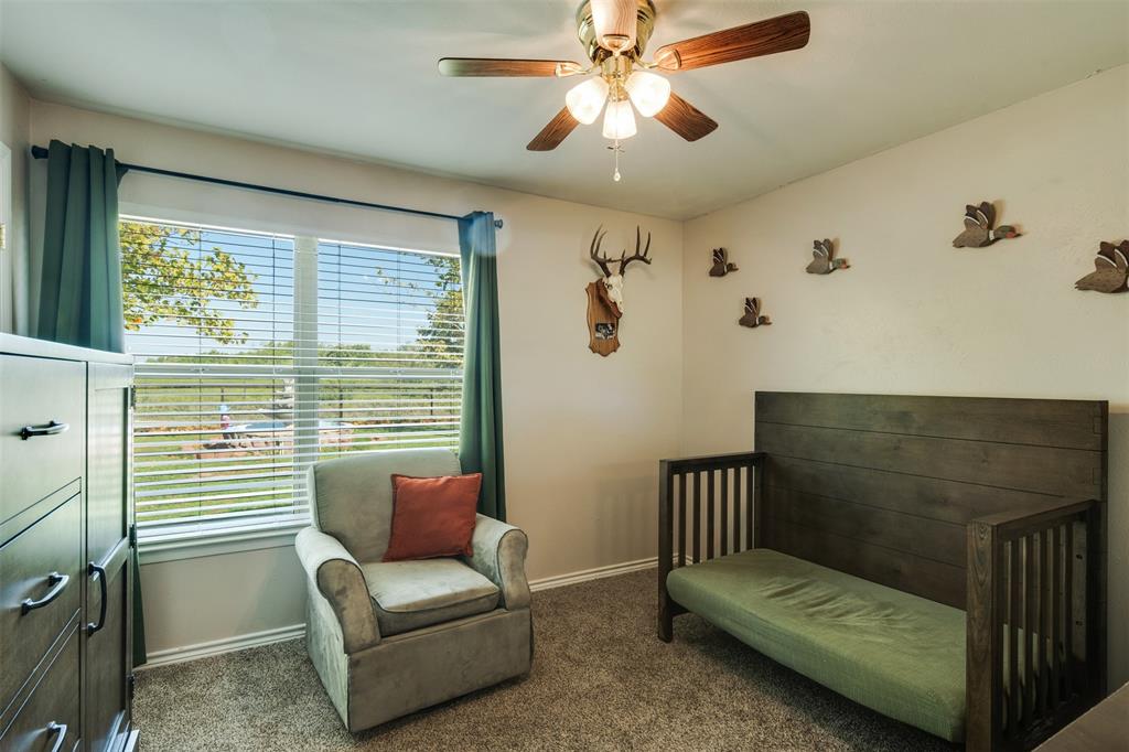 917 Cole Lane Sunset, TX 76270 - Photo 17 of 40 a living room with furniture and a window