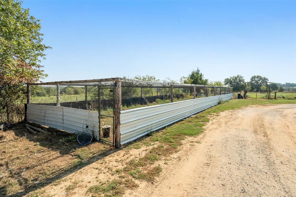 917 Cole Lane Sunset, TX 76270 - Photo 22 of 40 a view of a yard with wooden fence