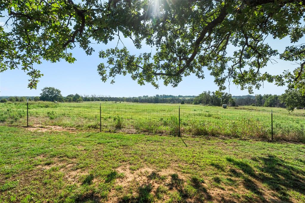 917 Cole Lane Sunset, TX 76270 - Photo 25 of 40 a view of a field with an trees