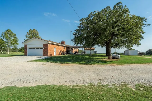 a view of a lake with houses in the background