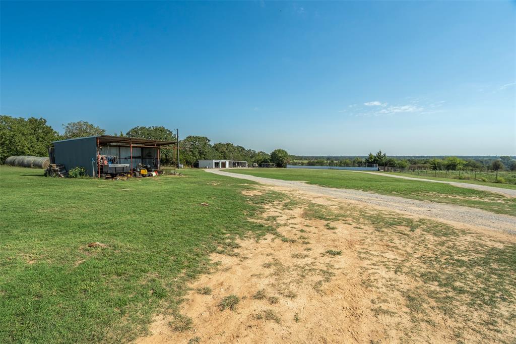 917 Cole Lane Sunset, TX 76270 - Photo 28 of 40 a view of a lake with houses in the background