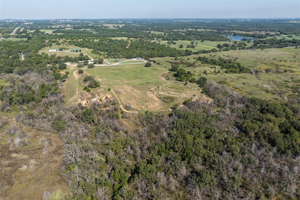 917 Cole Lane Sunset, TX 76270 - Photo 35 of 40 an aerial view of residential houses with outdoor space and trees