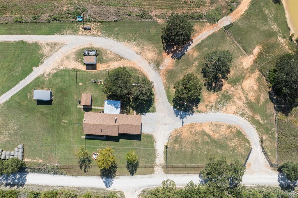 917 Cole Lane Sunset, TX 76270 - Photo 38 of 40 an aerial view of a house with outdoor space and lake view