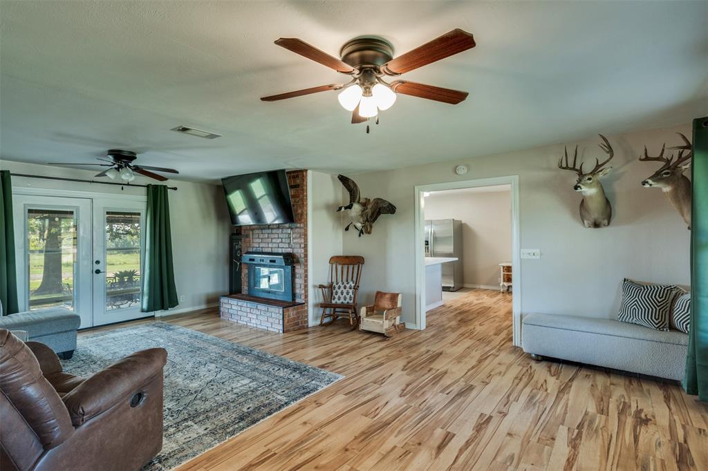 917 Cole Lane Sunset, TX 76270 - Photo 9 of 40 a living room with furniture and a fireplace