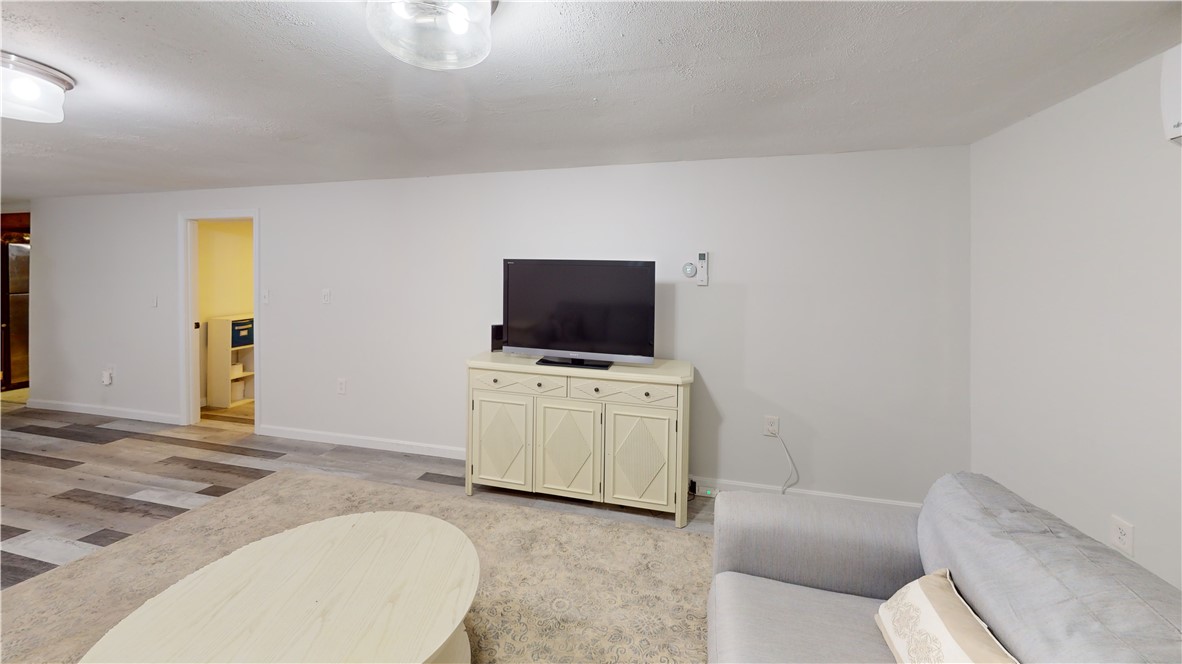74 Fales Road Bristol, RI 02809 - Photo 29 of 44 Facing the half bath to the left of the tv.