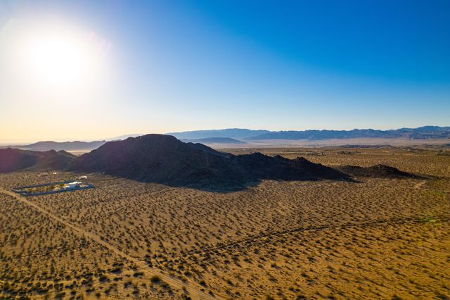 a view of an ocean and mountain