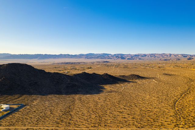 a view of a ocean with mountains