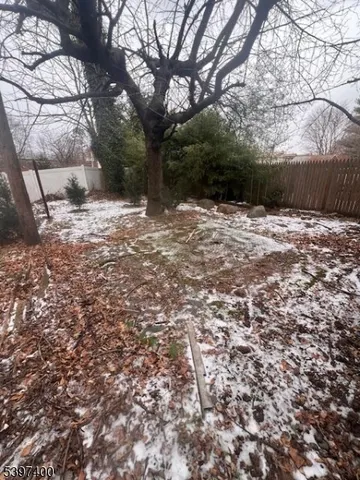 a view of a room with table and chairs