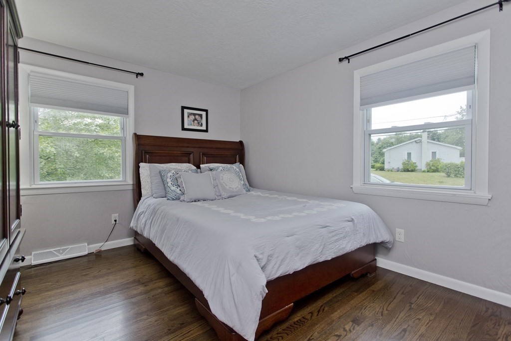 1041 Burts Pit Road Northampton, MA 01062 - Photo 15 of 22 a bed sitting in a bedroom next to a window