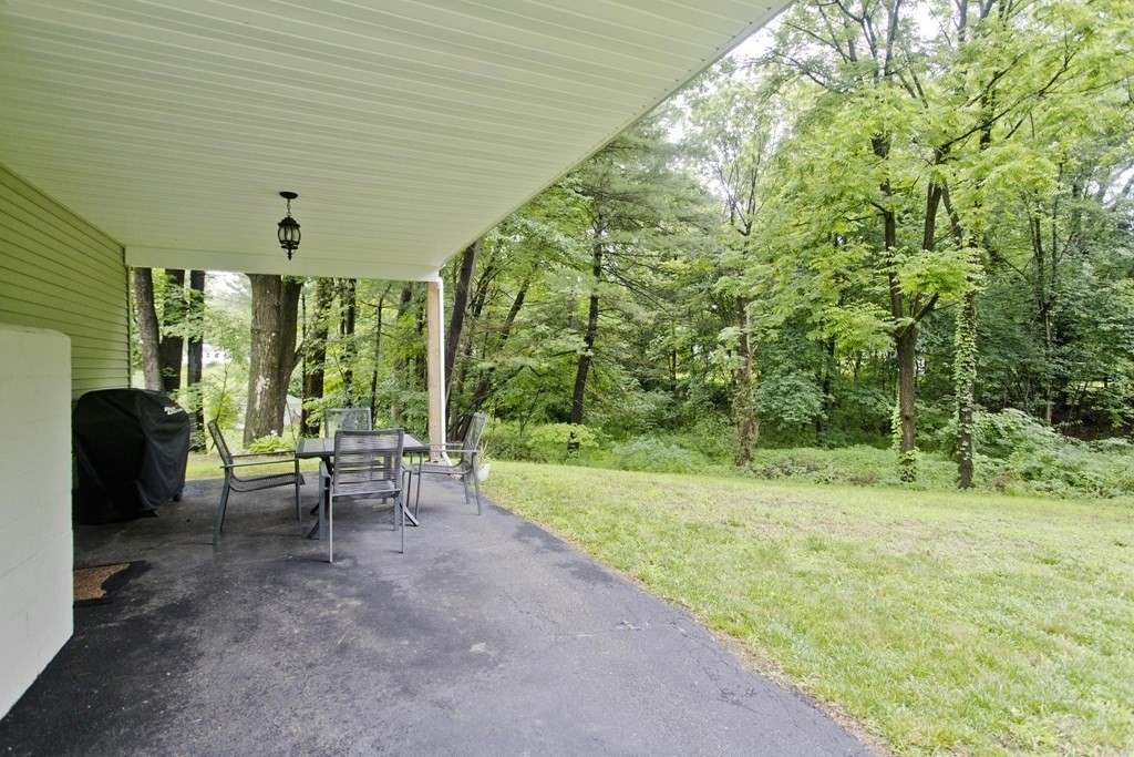 1041 Burts Pit Road Northampton, MA 01062 - Photo 22 of 22 a view of a backyard with furniture and garden
