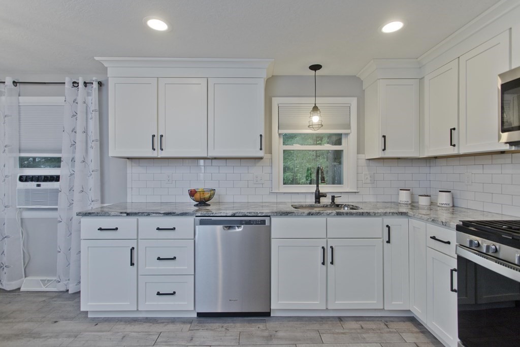 1041 Burts Pit Road Northampton, MA 01062 - Photo 3 of 22 a kitchen with white cabinets and sink