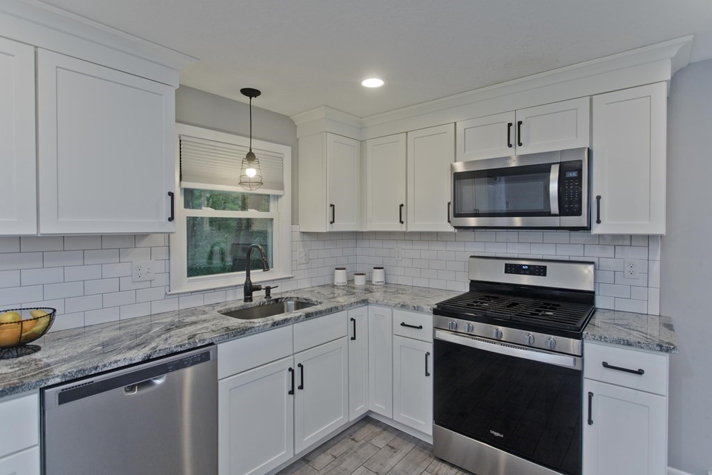 1041 Burts Pit Road Northampton, MA 01062 - Photo 4 of 22 a kitchen with cabinets stainless steel appliances a sink and a counter space