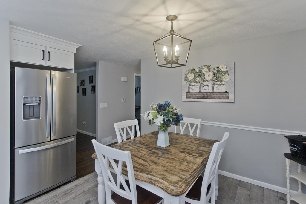 1041 Burts Pit Road Northampton, MA 01062 - Photo 5 of 22 a view of a dining room with furniture window and wooden floor